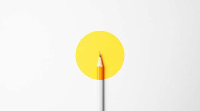 Yellow pencil on a white background