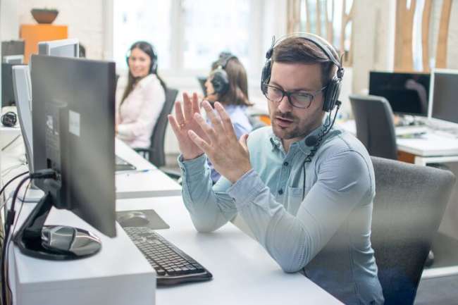 An answering services provider talking with a client