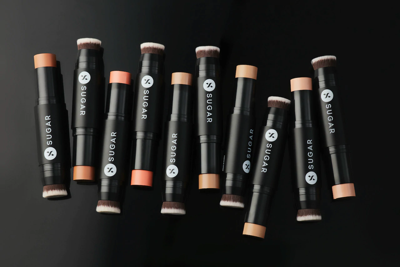 A selection of concealers by SUGAR Cosmetics against a black backdrop.