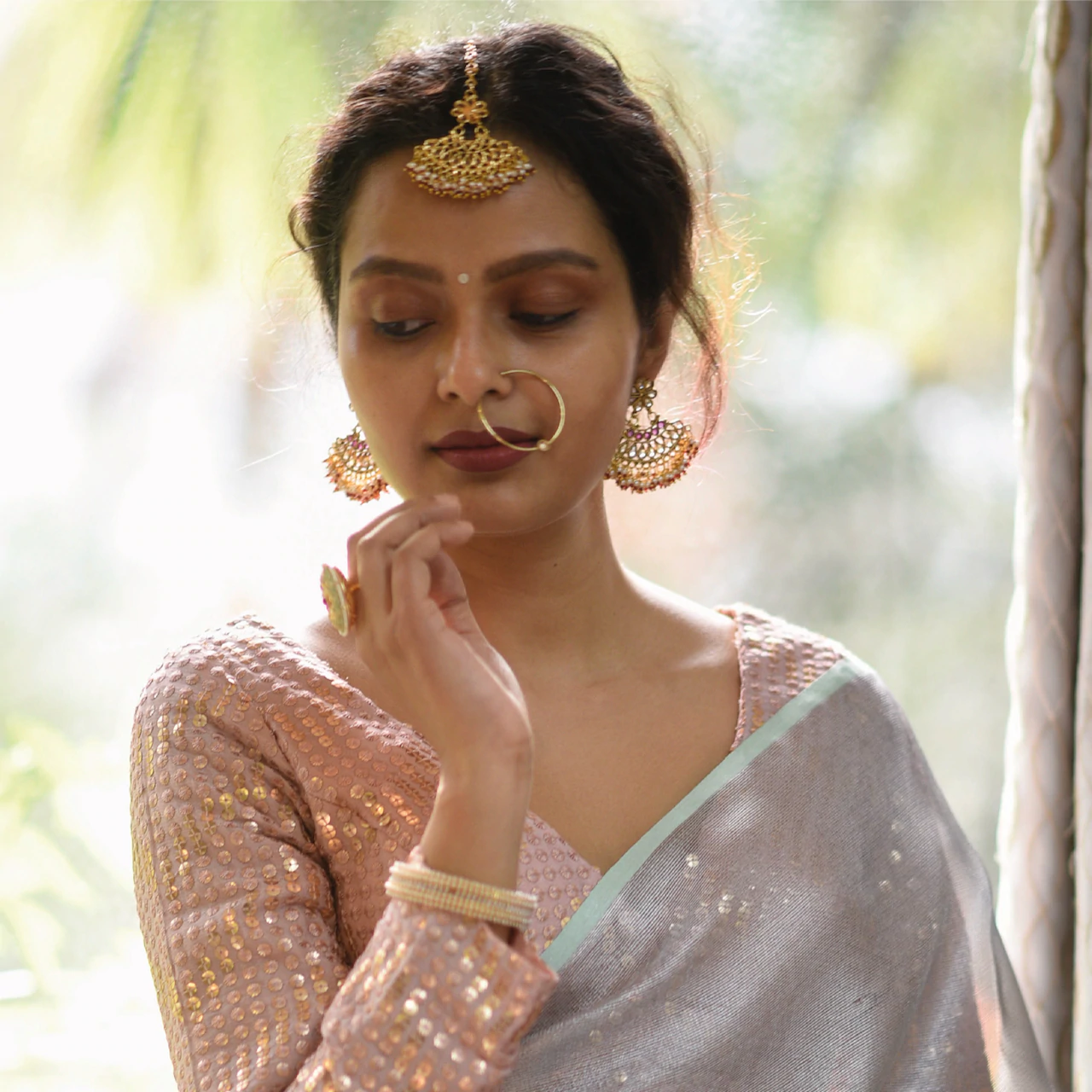 Sujata models a cream saree with a blue overlay.